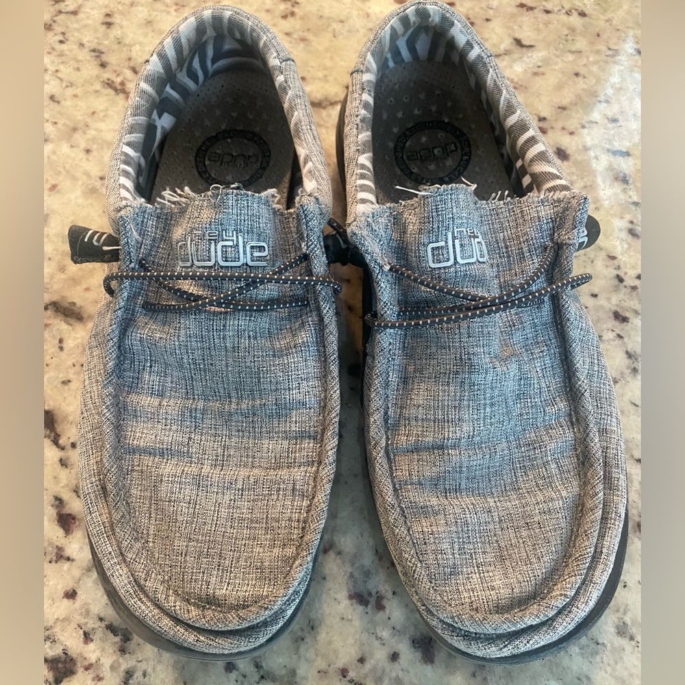 Gray Hey Dudes, some wear but still has a lot of life.  Mens size 9